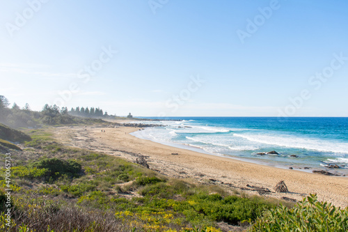 Fototapeta Naklejka Na Ścianę i Meble -  Ocean waves and sandy beach a sunny day. Nature tropical paradise background. Tuross Head, NSW, Australia