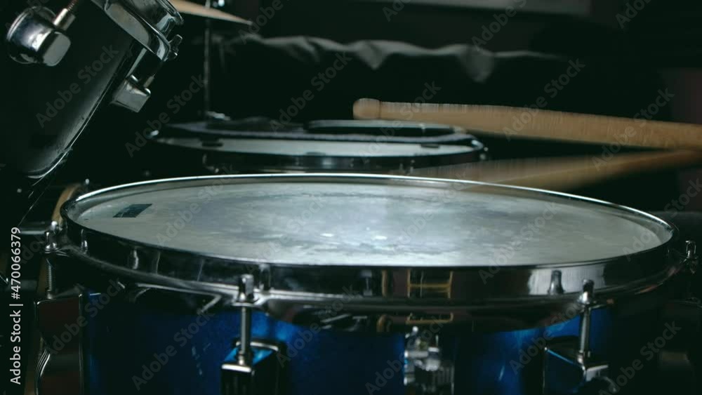 close up - the drummer plays with sticks on a snare drum, home lesson paradiddle training close up - the drummer plays with sticks on a snare drum, home lesson paradiddle training