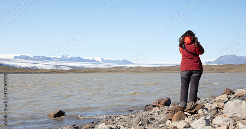 Woman enjoying the Icelandic landscape, Fjalsarlon photo