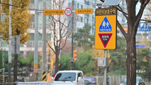School zone traffic sign and Camera that controls speeding cars. Seoul, South Korea