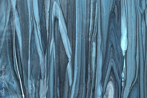 Abstract fluid art background light blue colors. Liquid marble. Acrylic painting on canvas with denim gradient.