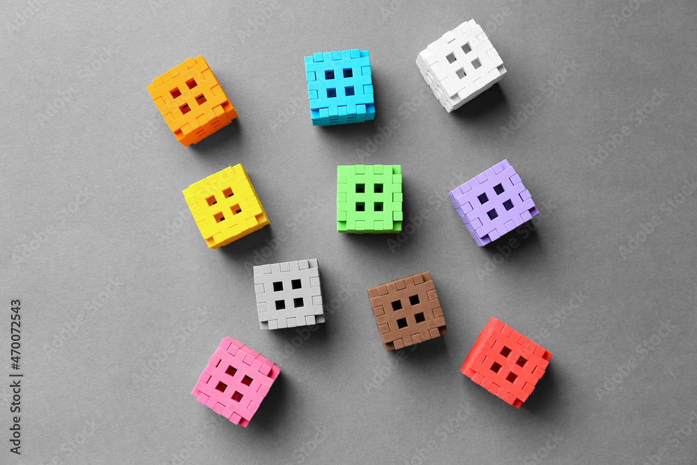 Multicolored cubes on a gray background Multicolored cubes on a gray background