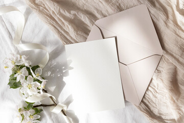 Card 5x7 mockup with pink envelope on beige background 