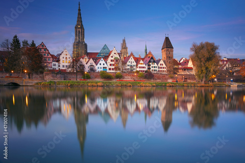 Ulm, Germany. Cityscape image of old town Ulm, Germany with the Ulm Minster, tallest church in the world and reflection of the city in Danube River at autumn sunset. © rudi1976