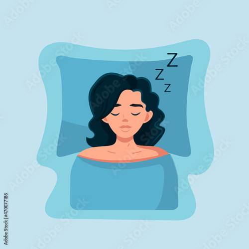 A young woman sleeps at home on a bed