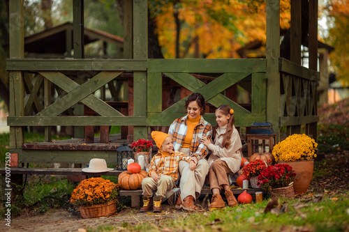 Picnic in nature in the forest in autumn. Happy family mother and children spend time together