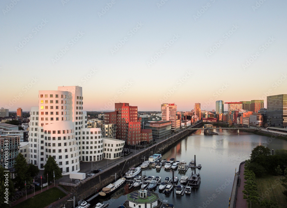 Germany, North Rhine Westphalia, Düsseldorf, Modern Architecture at the Media Harbour at sunrise,
