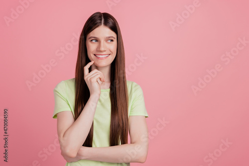 Portrait of positive minded girl look copyspace touch chin finger think thoughts isolated over pastel color background
