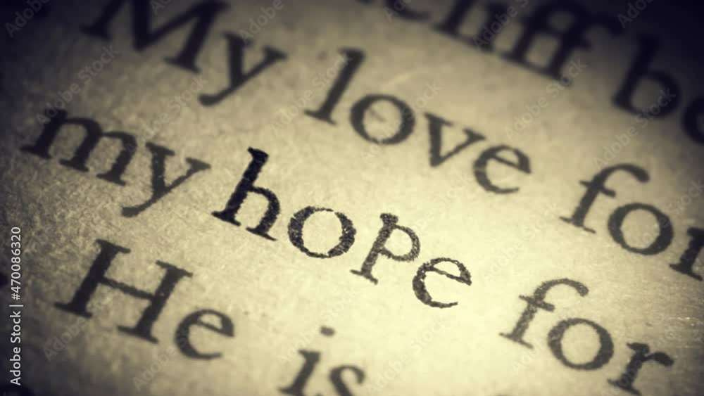 The word Hope on an old page in the book is separated from the general text and zooms into the camera. Creative 3D 4k slow motion video animation. The word Hope on an old page in the book is separated from the general text and zooms into the camera. Creative 3D 4k slow motion video animation.