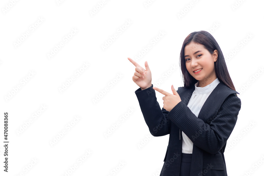 A beautiful Asian Thai woman in a suit is pointing both fingers to the left. She is smiling and looking at the camera against a white background. A beautiful Asian Thai woman in a suit is pointing both fingers to the left. She is smiling and looking at the camera against a white background.