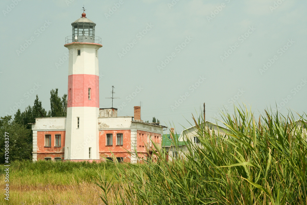 White - pink lighthouse. Landscape with lighthouse for poster, calendar, multicolor card, banner, cover, header for website. High quality photo