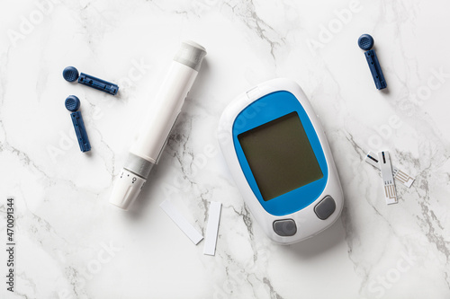 glucometer ketometer lancet and strips for self-monitoring of blood glucose or ketones level. diabetes or keto diet photo