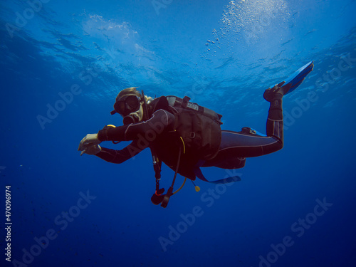 Scuba diver in clear blue water. Diving in clear water. Sardinia Italy