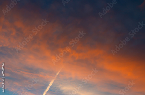 Colorful sunset background with dark and light parts in sky