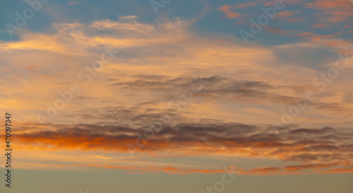 Colorful sunset background with dark and light parts in sky