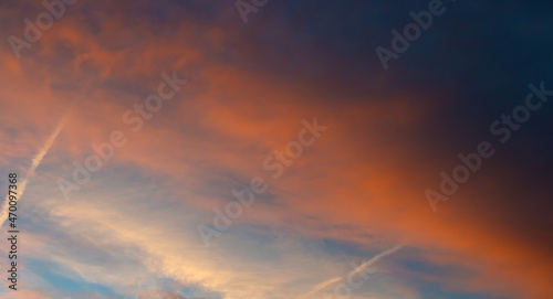 Colorful sunset background with dark and light parts in sky