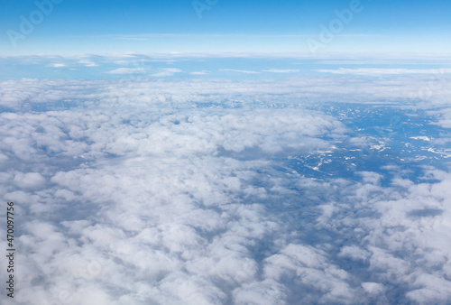 Airplane point of view . Clouds and mountains view from above 