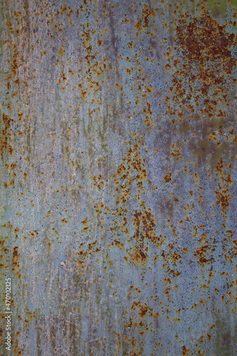 the texture of a rusty wall , a combination of blue and red