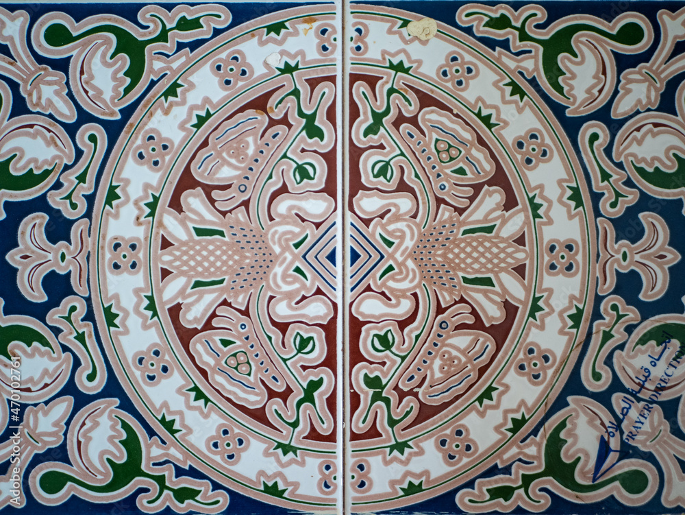 Tile with abstract patterned texture background in oriental style of blue, white and green ornaments.