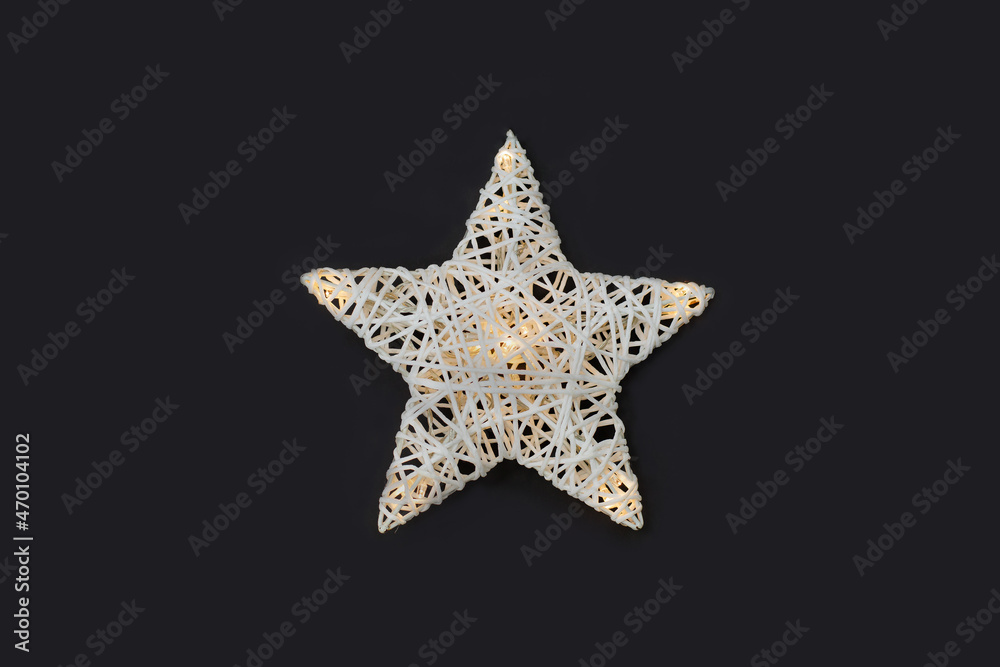 White star shaped night lamp on the on black background. White star shaped night lamp on the on black background.
