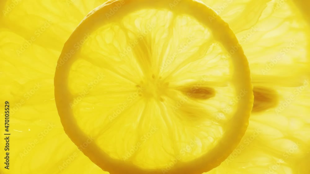Lemon stop motion animation. Looping animation of round yellow lemon slice, juicy citrus, fresh organic fruit close up