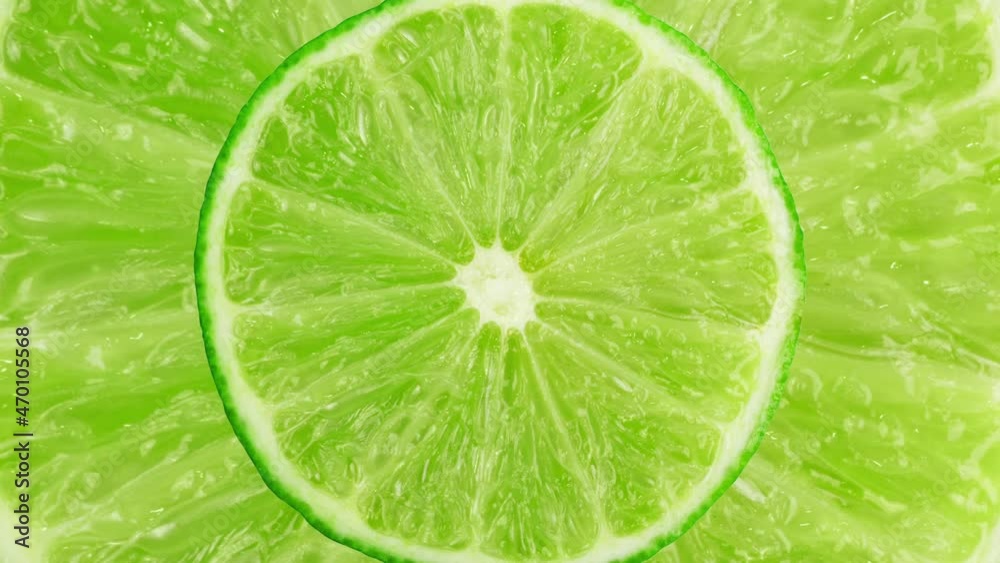 Lime stop motion animation. Looping animation of round green lime slice, juicy citrus, fresh organic fruit close up