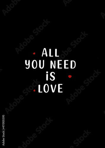 Motivation quote “all you need is love”, white text in a black background