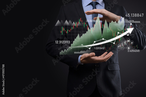 Businessman hold sales data and economic growth graph chart. Business planning and strategy. Analysing trading of exchange. Financial and banking. Technology digital marketing.Profit and growing plan.