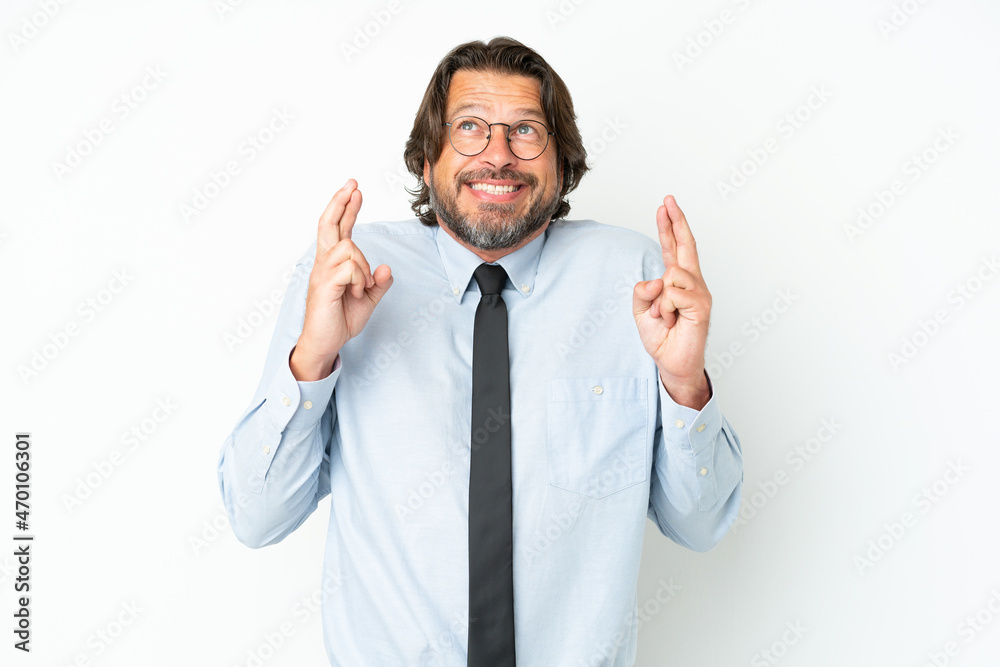 Senior dutch business man isolated on white background with fingers crossing Senior dutch business man isolated on white background with fingers crossing