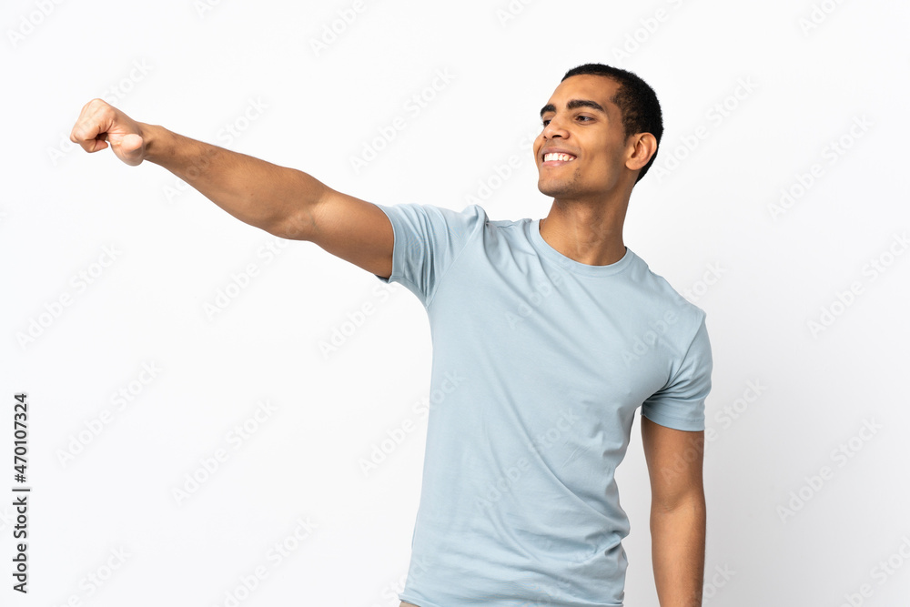 African American man over isolated white background giving a thumbs up gesture African American man over isolated white background giving a thumbs up gesture