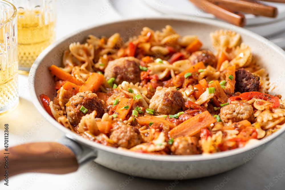 One pan dish. Pasta with onion, red pepper, garlic, tomatoes, carrot and meatballs.