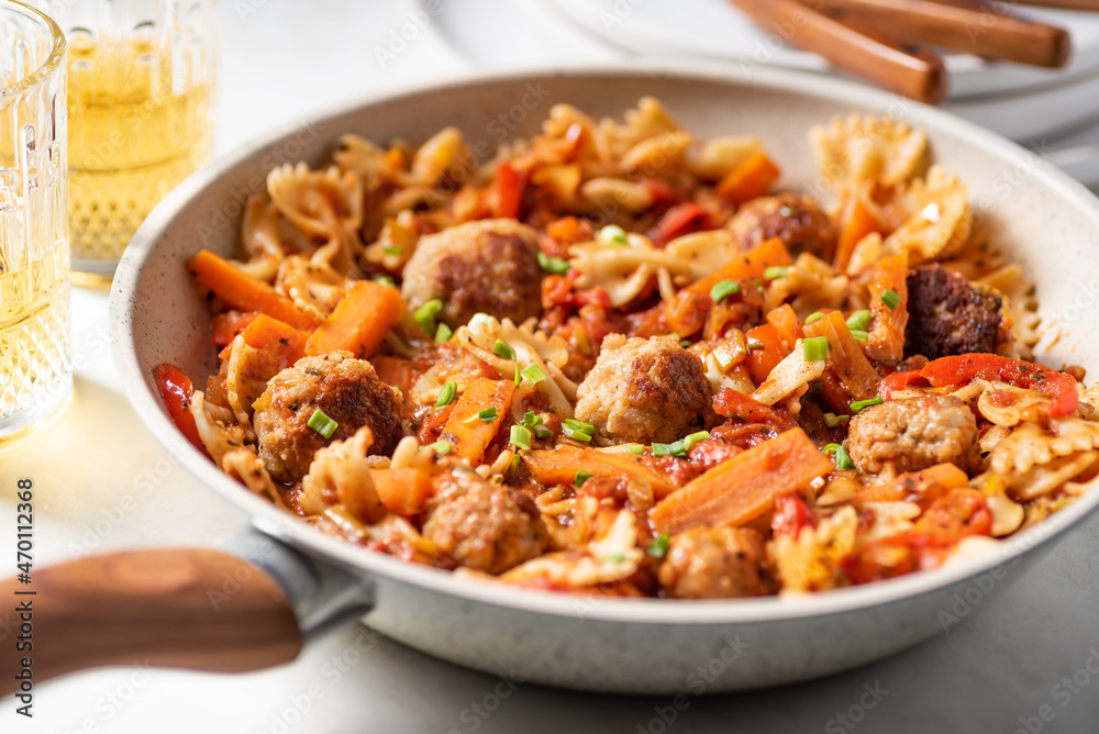 One pan dish. Pasta with onion, red pepper, garlic, tomatoes, carrot and meatballs. One pan dish. Pasta with onion, red pepper, garlic, tomatoes, carrot and meatballs.