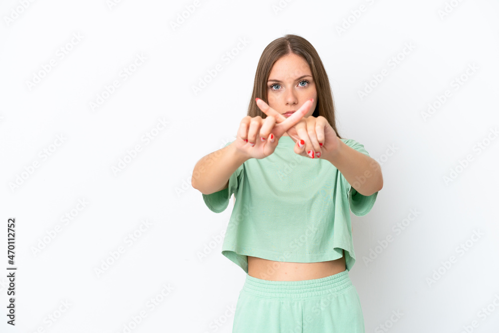 Young Lithuanian woman isolated on white background making stop gesture with her hand to stop an act Young Lithuanian woman isolated on white background making stop gesture with her hand to stop an act
