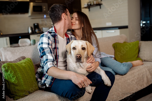 Wallpaper Mural couple sitting on sofa with dog Torontodigital.ca