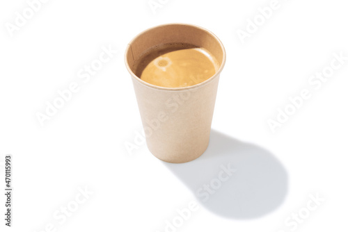 Top view of paper cup of coffee isolated on white background with shadow. Concept of worldwide national cuisines photo