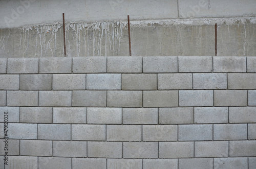 ugly holding a road notch of a bridge forecourt tunnel. retaining wall with concrete grouting is covered with fake, optically prettier wall. fencing with hollow bricks filled with wires, railing,steel