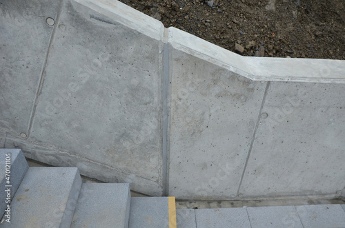roof staircase at the supporting concrete wall made of several monolithic castings. in order create a flexible and watertight connection of the expansion joint, it is filled with gray silicone rubber photo