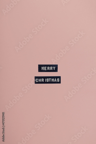 Fotografie, Obraz Wishes words Merry Christmas spelled black with embossed label maker