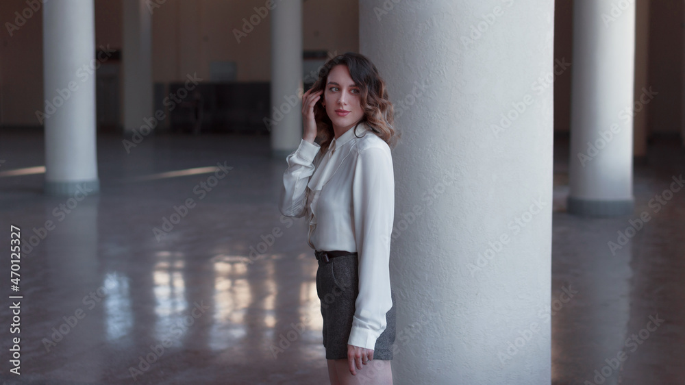 Portrait of a young attractive woman in a white shirt Portrait of a young attractive woman in a white shirt