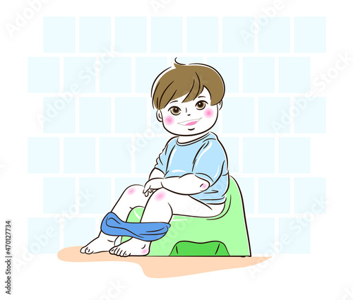 The child is sitting on the potty in the toilet 