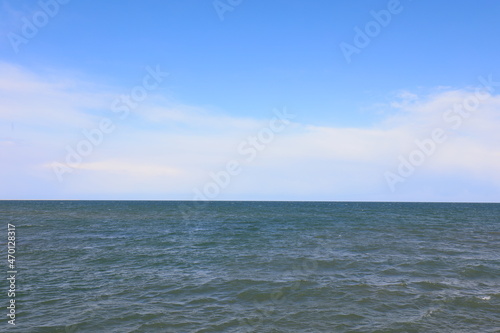 Ocean under blue sky and white clouds, North China