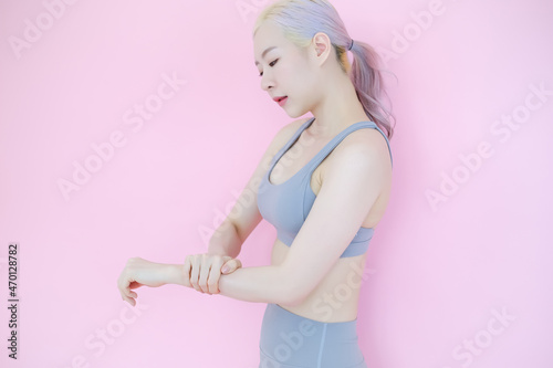beautiful asia woman on pink background  fitness sports and recreation concept