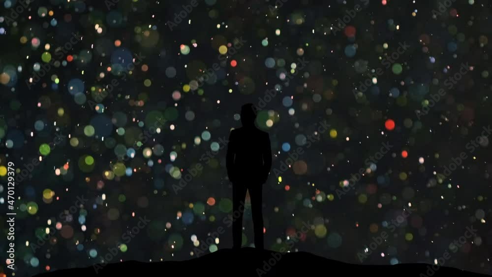The man in suit stands on a flying shimmering particles background