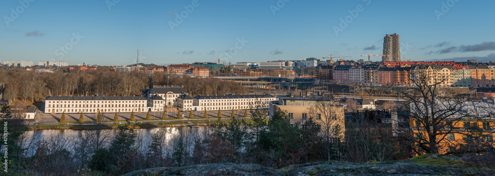 Panorama view over hills in the district Kungsholmen with apartment houses, the castle Karlbergs Slott from the district Stadshagen a sunny autumn day in Stockholm