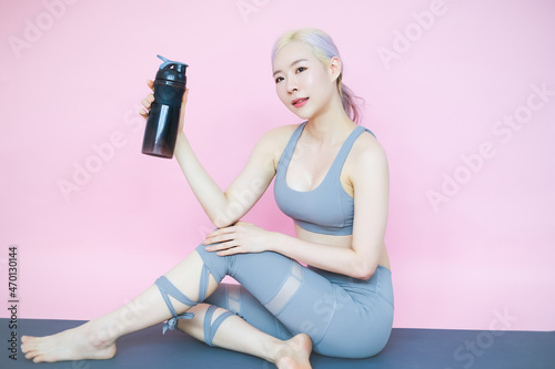 beautiful asia woman on pink background, fitness sports and recreation concept