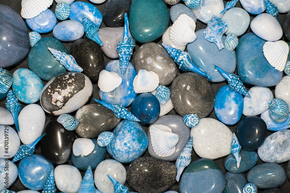 Beach pebble rocks and seashells. Blue toned nature backgound image Beach pebble rocks and seashells. Blue toned nature backgound image