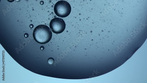 slow motion video of a water droplet falling on a glass plate