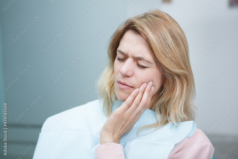 Mature female patient at dental clinic having toothache Mature female patient at dental clinic having toothache