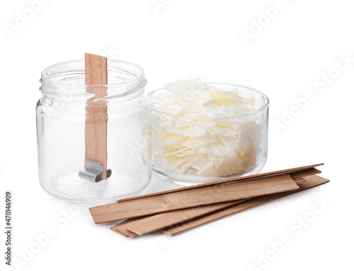 Wax flakes and wooden wicks on white background. Making homemade candle