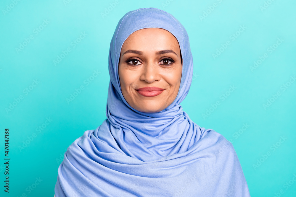 Photo of shiny pretty young woman wear arab headscarf smiling isolated turquoise color background Photo of shiny pretty young woman wear arab headscarf smiling isolated turquoise color background
